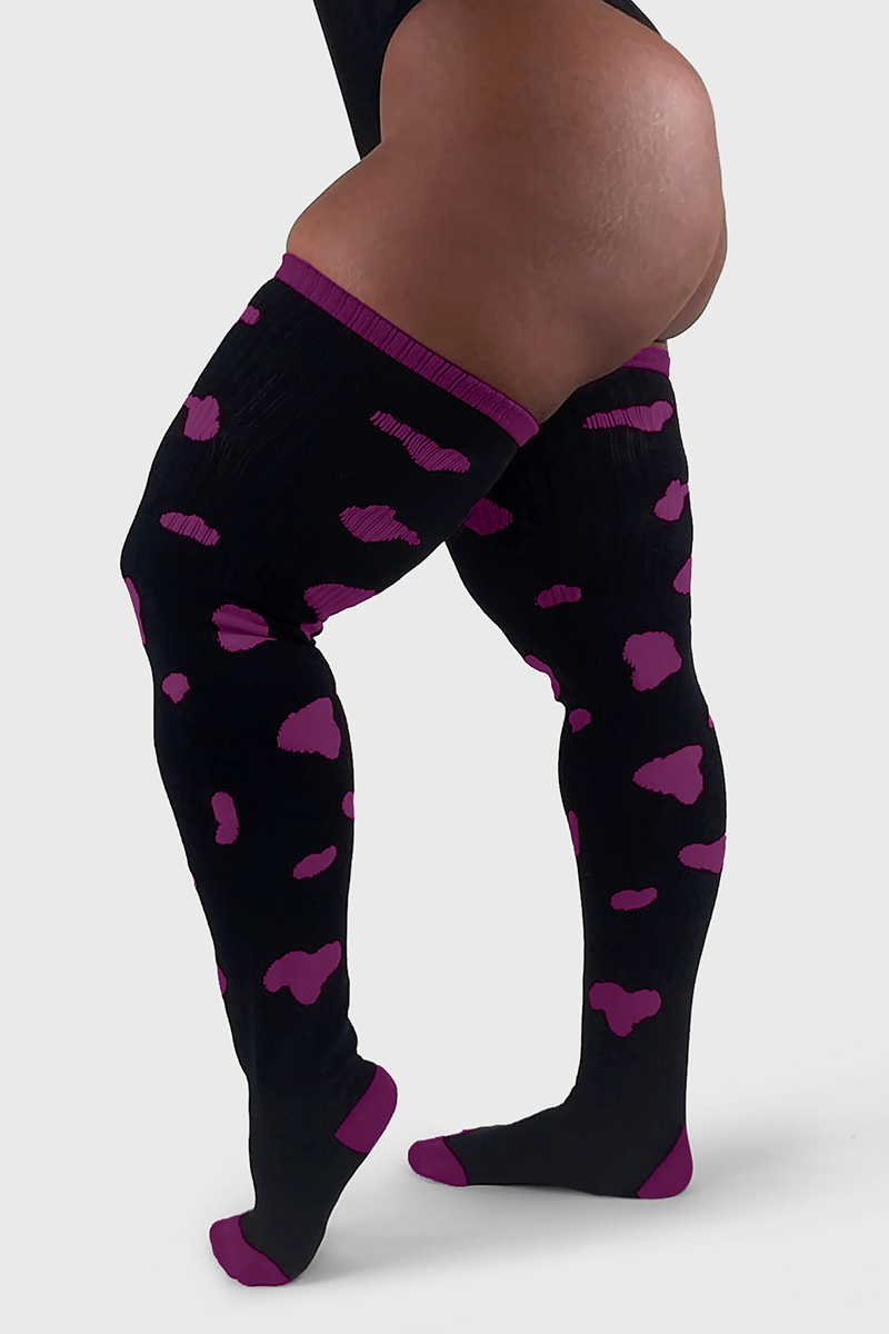 THUNDA THIGHS Tūbbies - Cow Print (Black w/Purple Spots)
